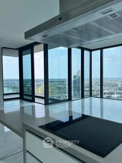 Luxurious modern kitchen with panoramic city view and sleek design