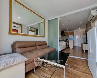 Modern living room with stylish furniture and open kitchen layout