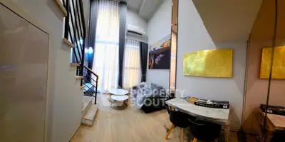 Modern duplex living room with high ceilings and stylish decor