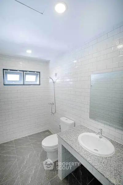 Modern bathroom with sleek tiles and minimalist fixtures