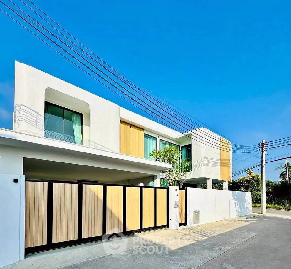 Modern two-story house with sleek design and spacious driveway