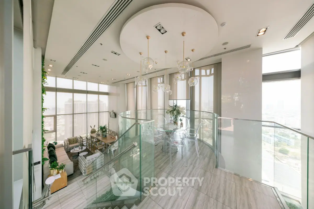 Luxurious modern living room with glass staircase and panoramic city views