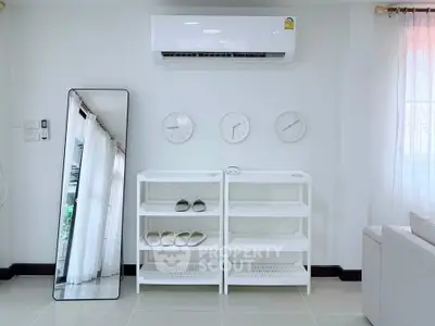 Modern living room with sleek air conditioning and minimalist decor