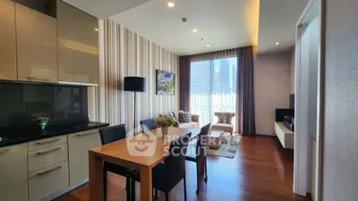Modern living room with dining area, stylish decor, and large window offering city views.