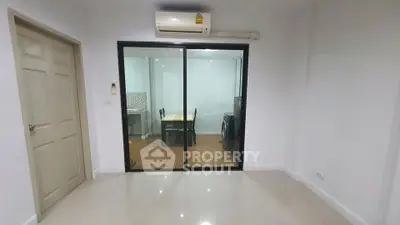Modern apartment interior with glass sliding doors and air conditioning