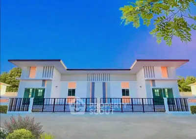Modern duplex with sleek design and vibrant colors, featuring a spacious driveway and lush greenery.
