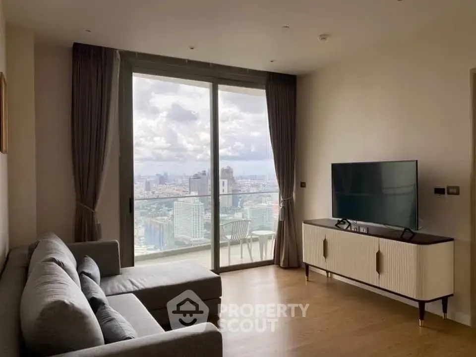 Modern living room with stunning city view from large window and stylish furniture.