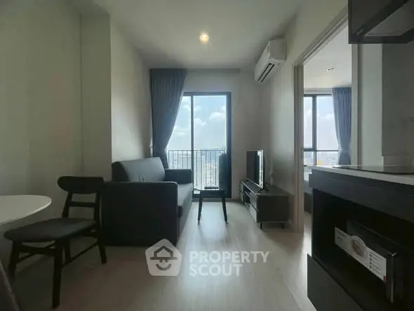 Modern living room with balcony view in high-rise apartment