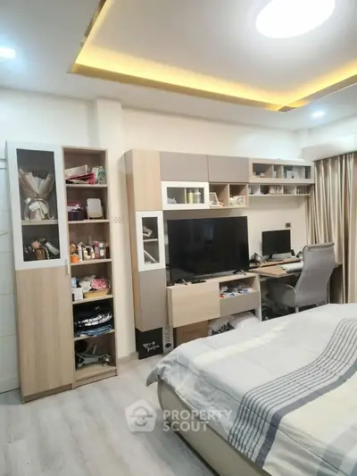Modern bedroom with stylish furniture, built-in storage, and cozy ambiance.