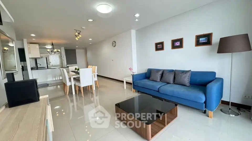 Spacious modern living room with open kitchen and stylish decor