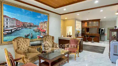 Luxurious living room with elegant furniture and large artwork, perfect for sophisticated gatherings.