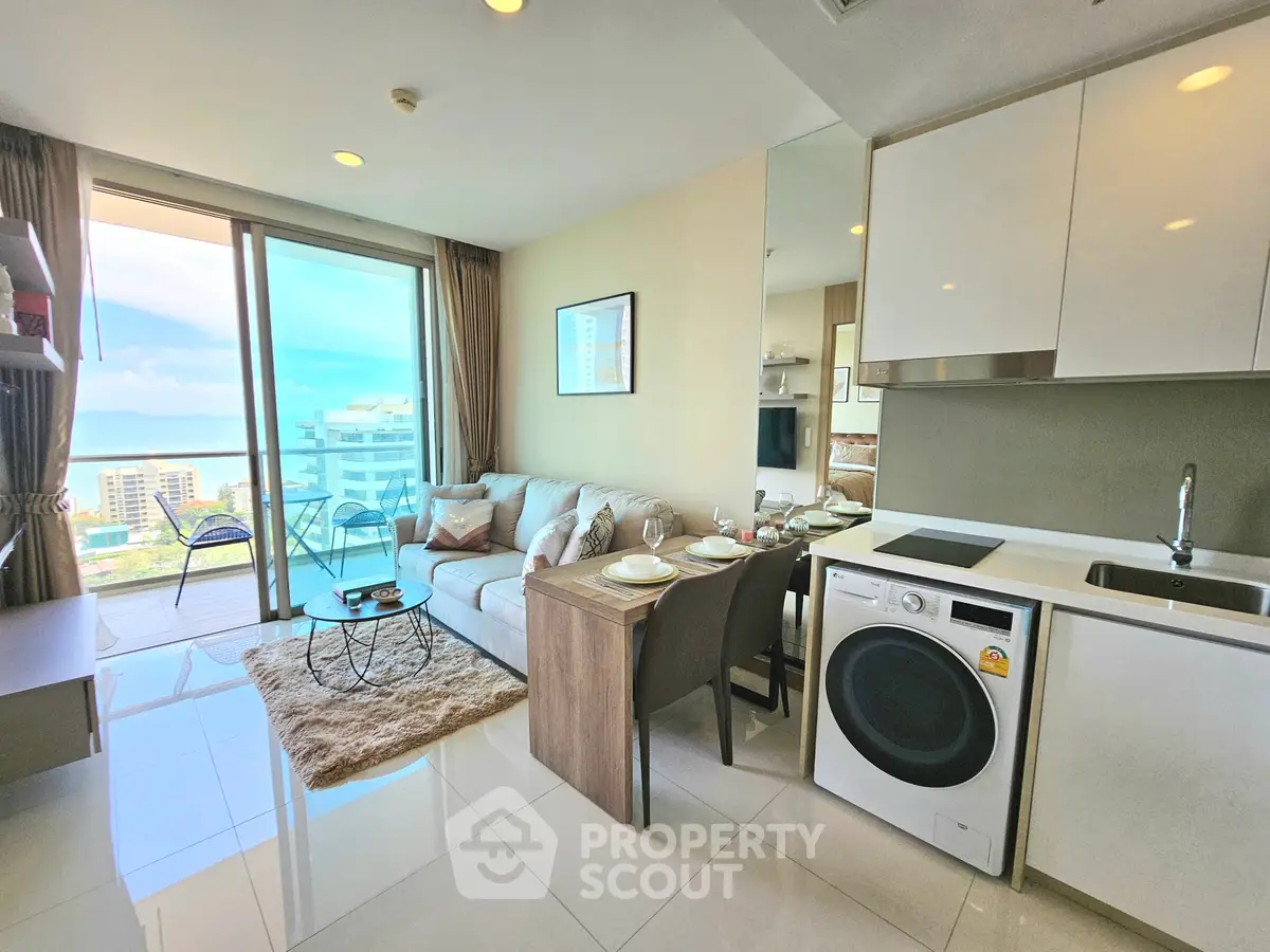 Modern living room with ocean view and integrated kitchen in luxury apartment