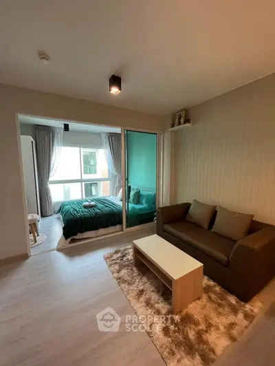 Modern studio apartment with cozy living area and stylish bedroom