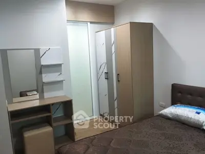 Modern bedroom with stylish wardrobe and vanity set, perfect for a cozy living space.