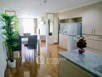 Spacious open-layout kitchen and dining area with modern appliances and elegant decor.