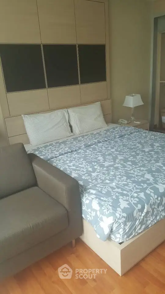 Cozy bedroom with stylish decor and comfortable bedding in modern apartment.