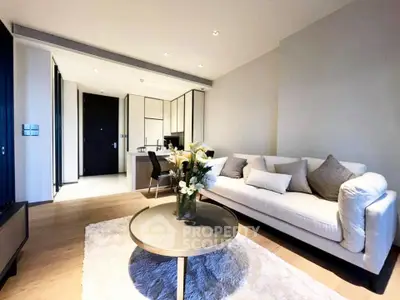 Modern living room with cozy sofa and elegant decor in a stylish apartment.
