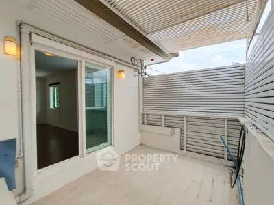 Charming balcony with modern design and ample natural light, perfect for relaxation and outdoor enjoyment.