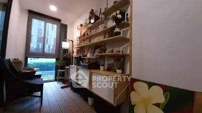 Charming study room with modern shelving and garden view, perfect for productivity and relaxation.