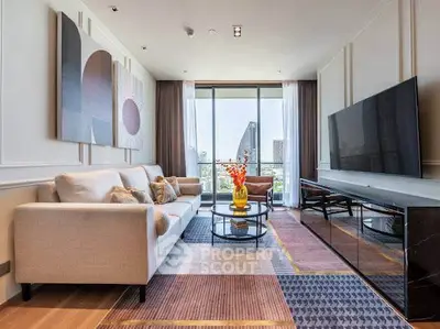 Luxurious modern living room with large TV and stunning city view through floor-to-ceiling windows.