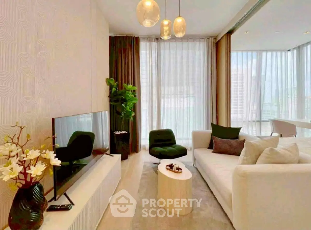 Modern living room with stylish decor and large windows in a luxury apartment.
