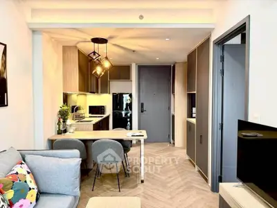 Modern open-plan living room and kitchen with stylish decor and lighting