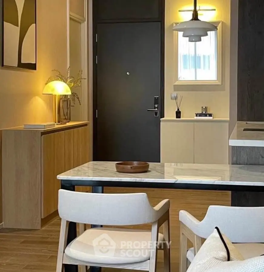 Modern interior with stylish dining area and elegant lighting, perfect for contemporary living.