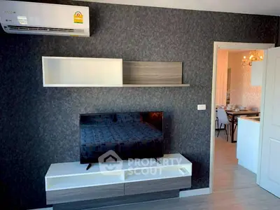 Modern living room with sleek TV stand and wall-mounted shelves