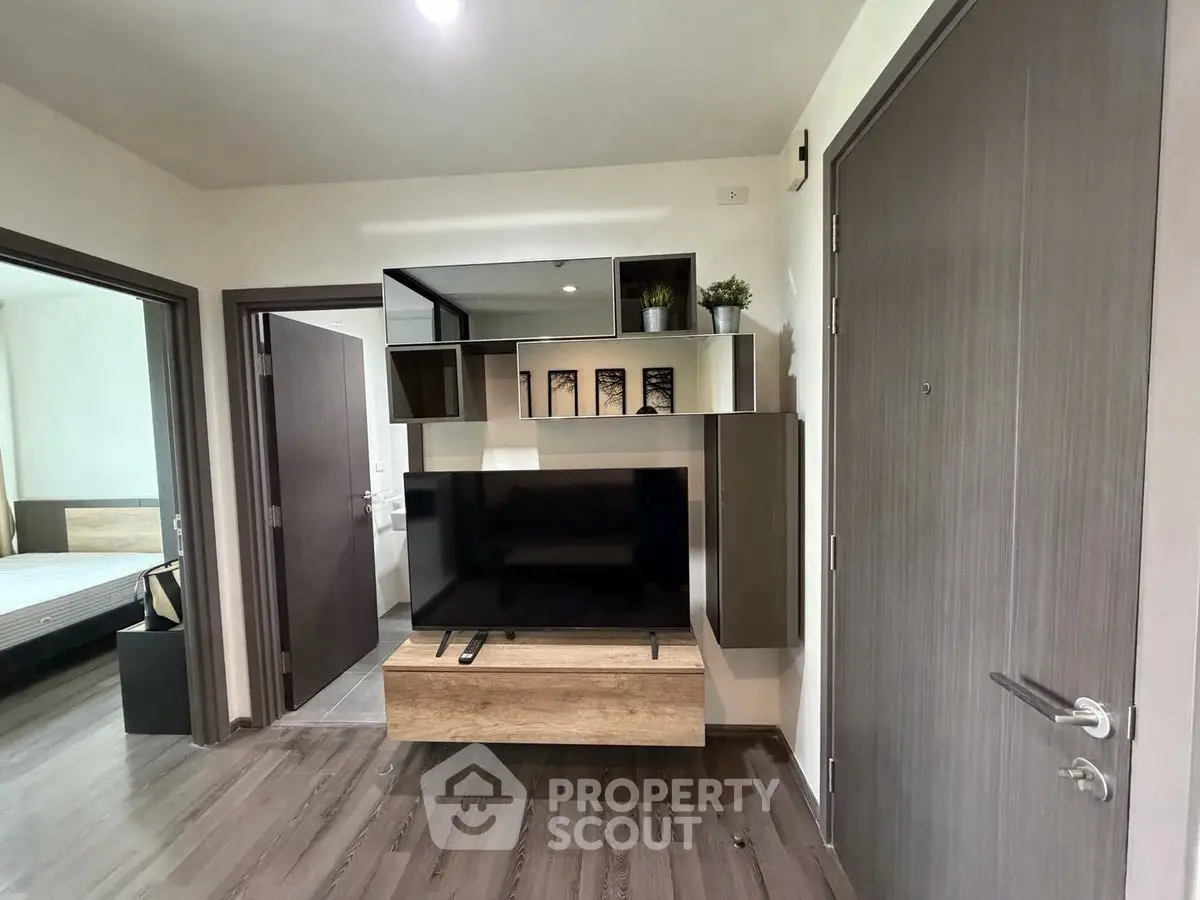 Modern apartment interior with stylish TV unit and wooden flooring