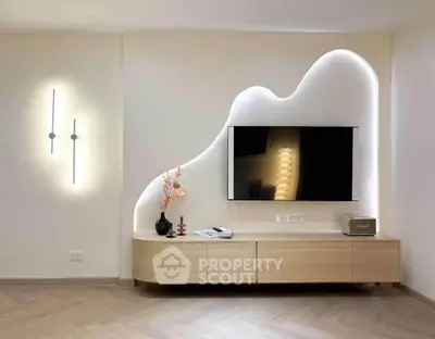 Modern living room with stylish TV wall design and elegant lighting