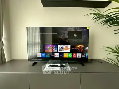 Modern living room with sleek TV setup on stylish console