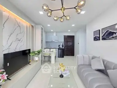 Modern living room with elegant decor and open kitchen layout