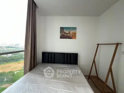 Cozy bedroom with city view and minimalist decor