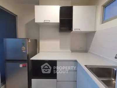 Modern kitchen with sleek cabinetry and stainless steel appliances