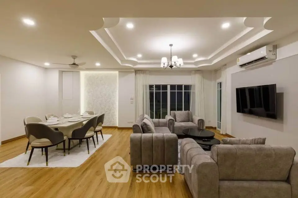 Spacious modern living room with elegant dining area and stylish furnishings