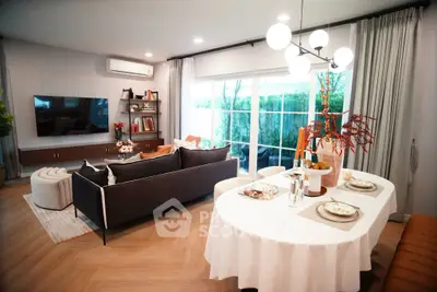 Spacious modern living room with elegant dining area and large windows