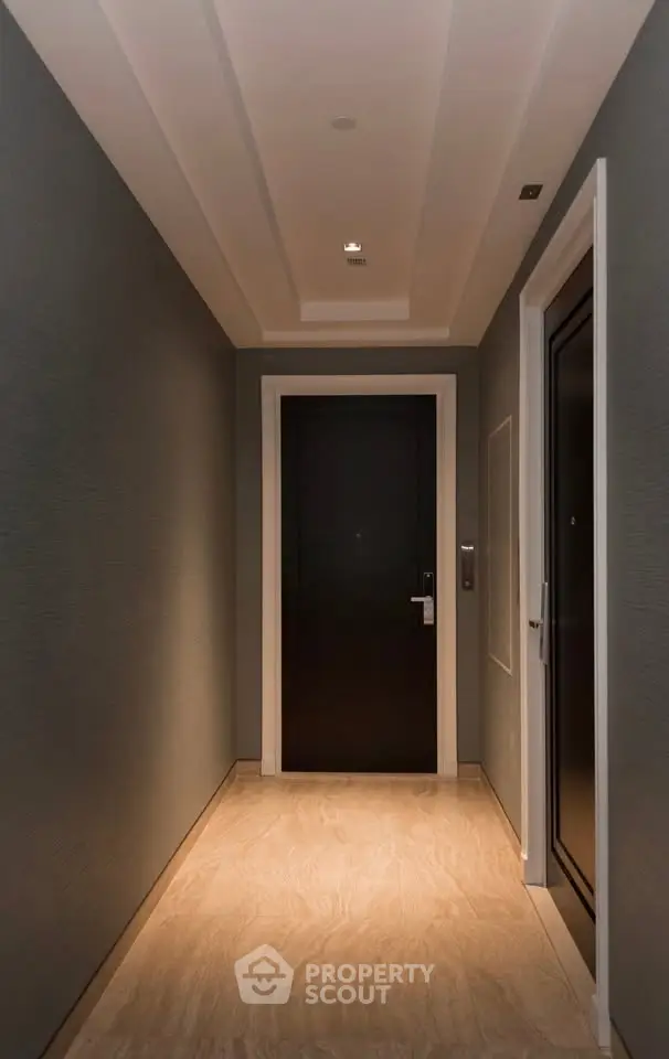 Elegant apartment corridor with modern lighting and sleek design