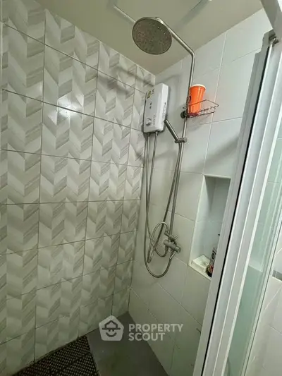 Modern bathroom with stylish tile design and shower unit