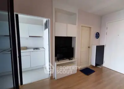 Modern apartment interior with compact kitchen and cozy living area