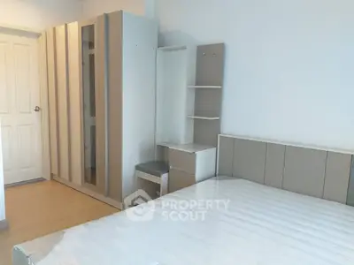 Modern bedroom with sleek wardrobe and minimalist design