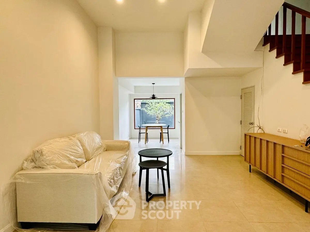 Spacious modern living room with minimalist design and natural light
