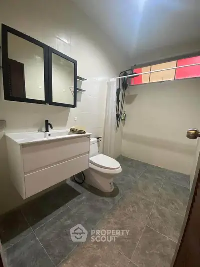 Modern bathroom with sleek fixtures and ample natural light