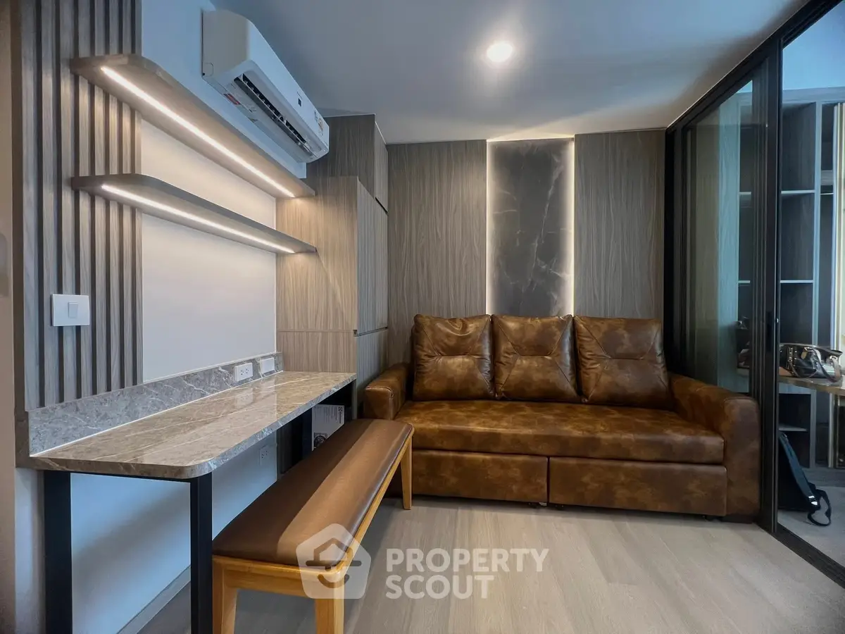 Modern living room with leather sofa and stylish lighting