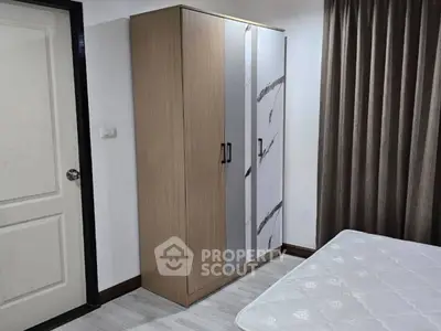 Modern bedroom with sleek wardrobe and comfortable mattress