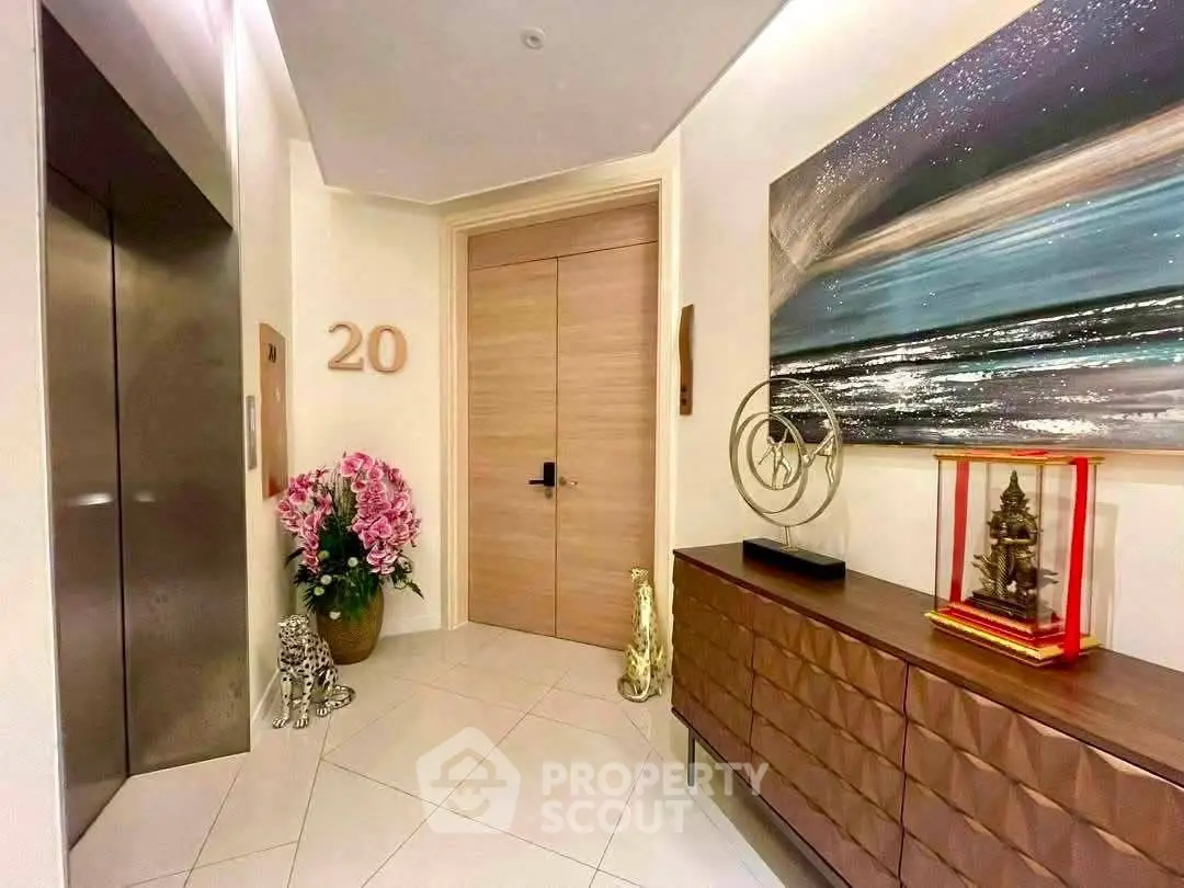 Elegant apartment entrance with modern decor and elevator access