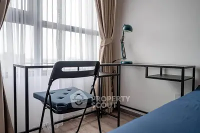 Modern study area with sleek desk and chair by a large window