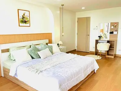 Spacious and bright bedroom with modern decor and cozy ambiance