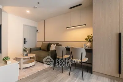 Modern living room with stylish furniture and elegant lighting in a cozy apartment.