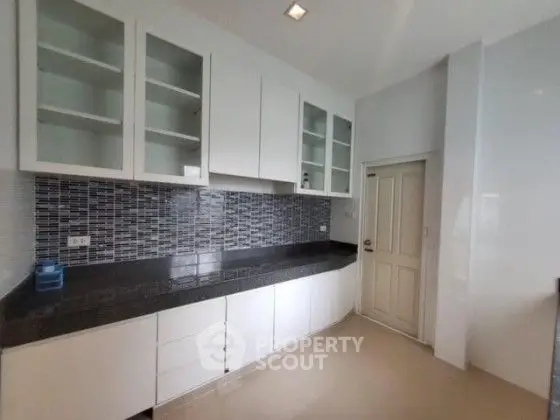 Modern kitchen with sleek cabinets and stylish backsplash