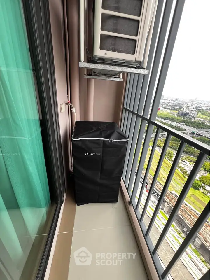 Modern balcony with city view and air conditioning unit, perfect for urban living.